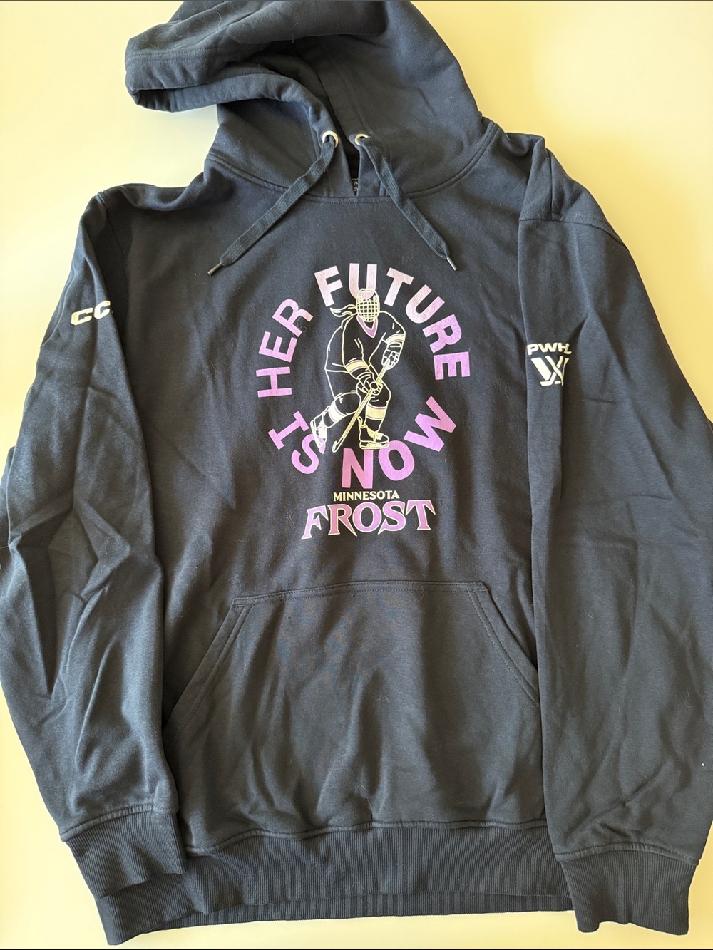 PWHL Hoodie CCM Minnesota Frost Hockey Navy Hoodie with Female Skater Graphic